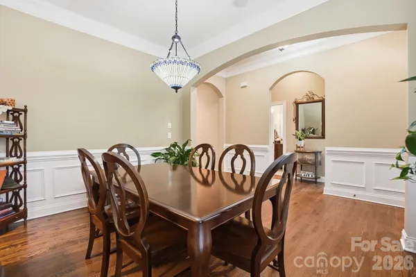 a work room with furniture and wooden floor