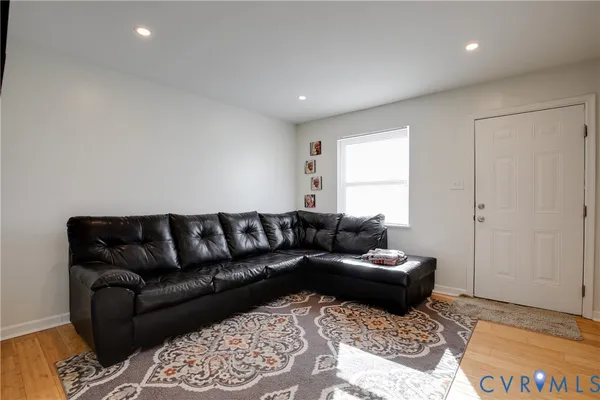 a living room with a couch and a rug