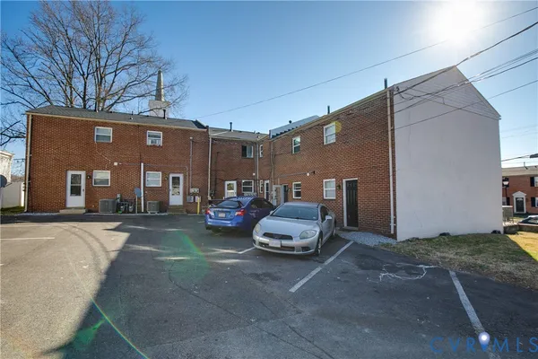 a front view of a house with parking space