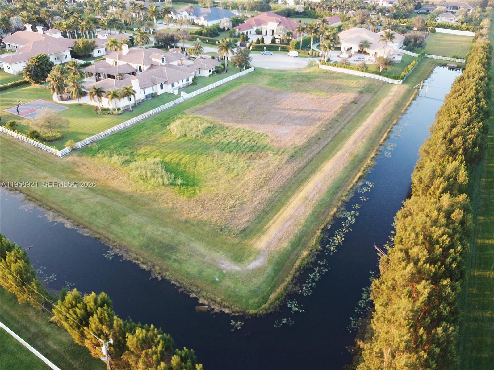 16700 Berkshire Court Southwest Ranches, FL 33331 - Photo 2 of 11 an aerial view of residential houses with outdoor space