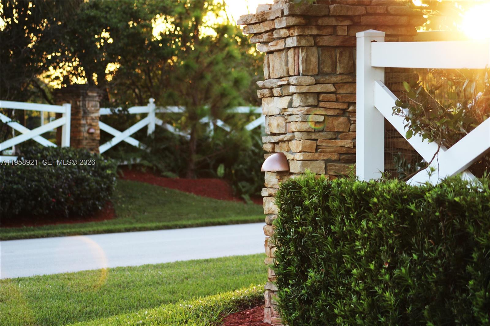 16700 Berkshire Court Southwest Ranches, FL 33331 - Photo 8 of 11 a front view of a house with a yard