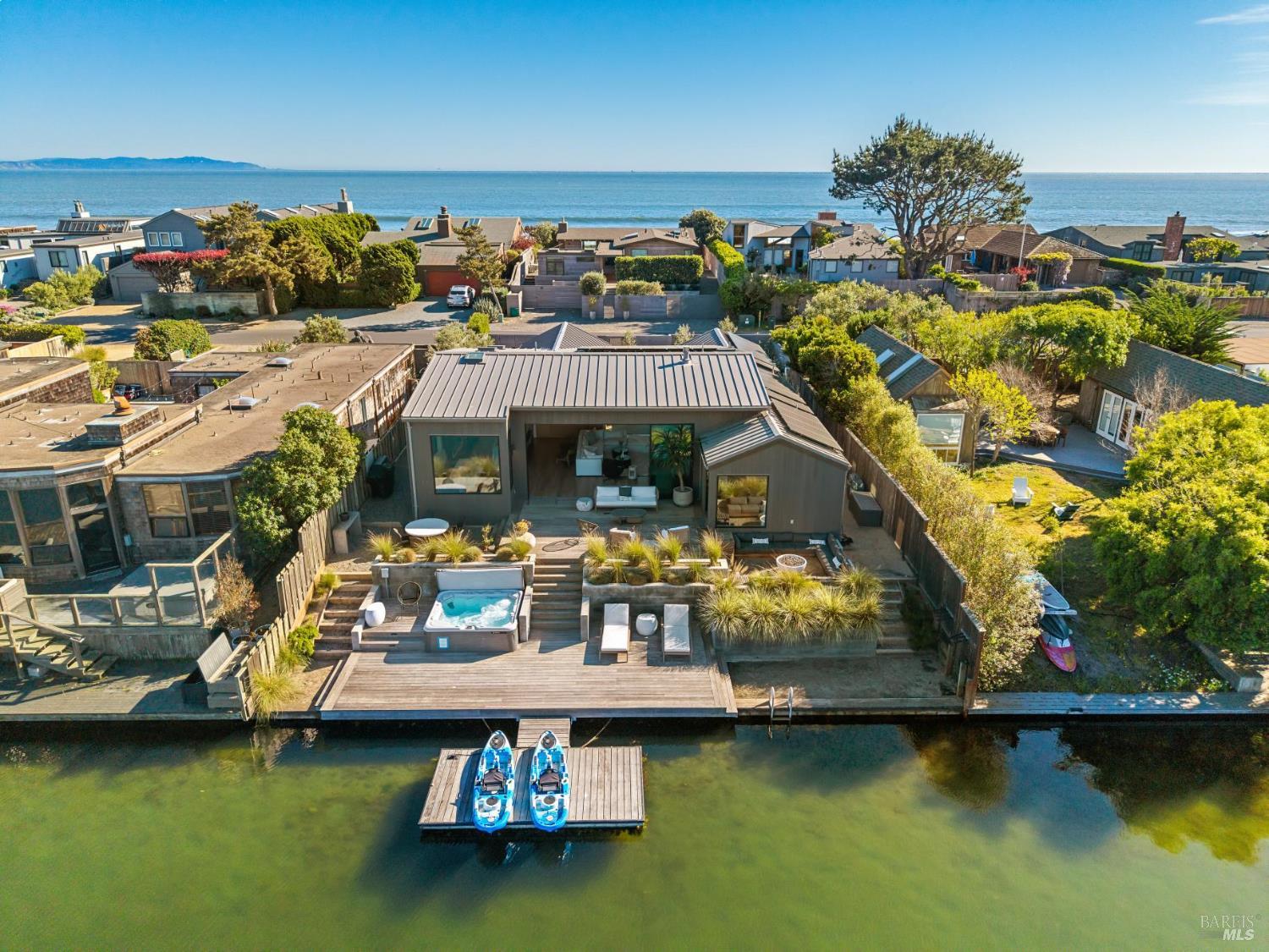297 Seadrift Road Stinson Beach, CA 94970 - Photo 1 of 30 a view of a lake with a house