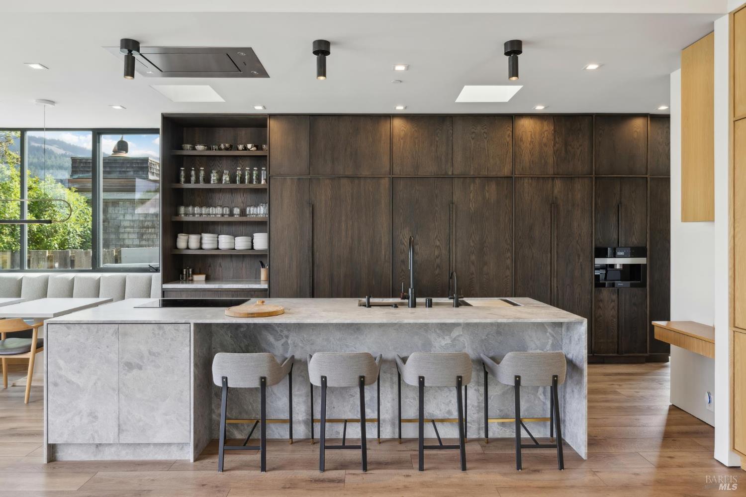 297 Seadrift Road Stinson Beach, CA 94970 - Photo 19 of 68 a large kitchen with a table and chairs