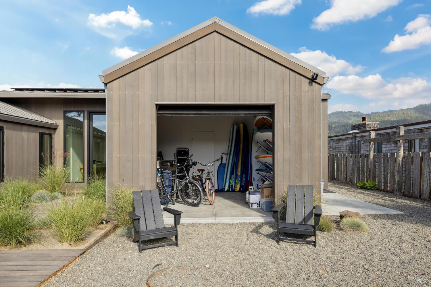 297 Seadrift Road Stinson Beach, CA 94970 - Photo 21 of 30 a view of a wooden house with glass door and outdoor space