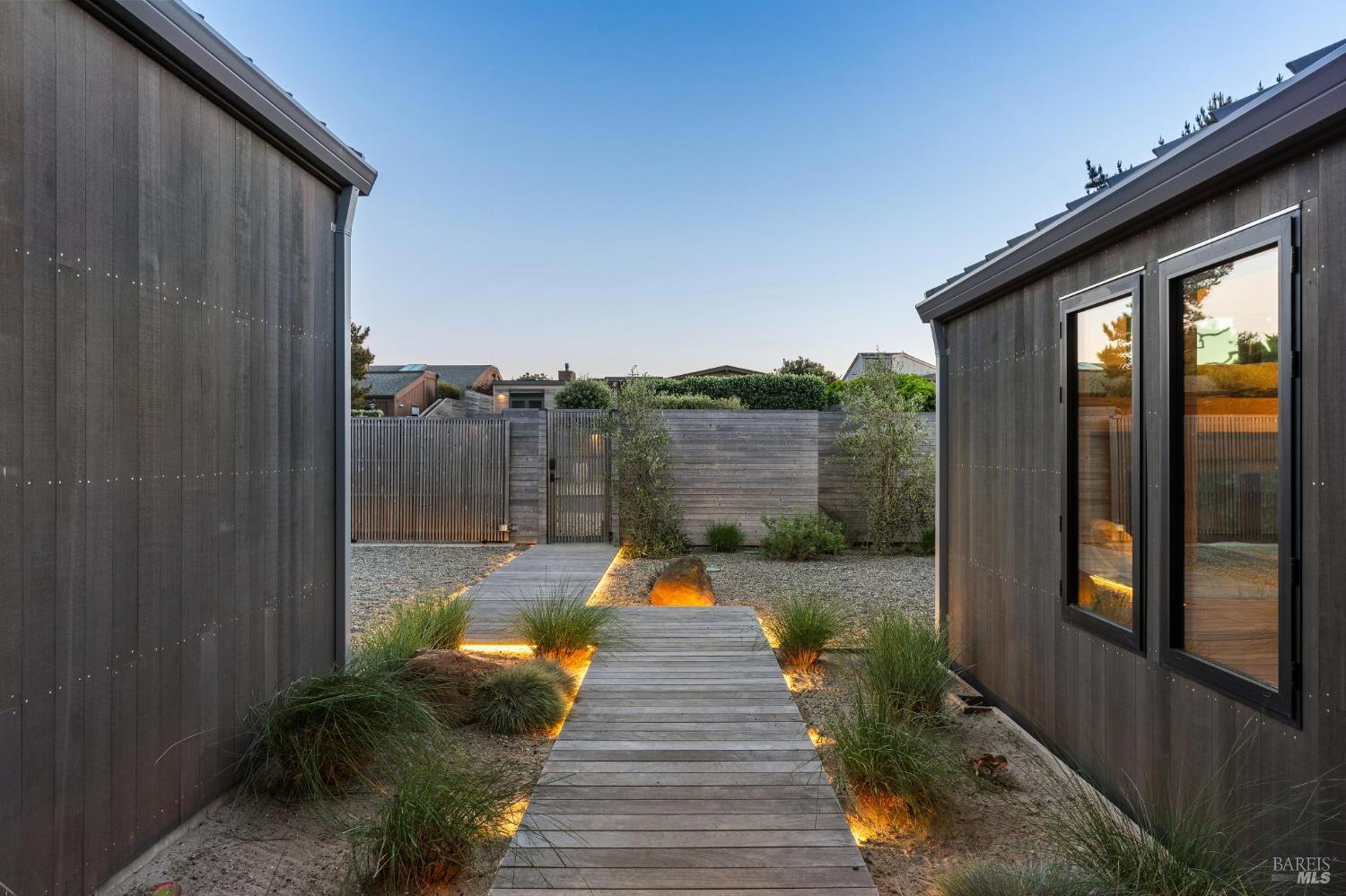 297 Seadrift Road Stinson Beach, CA 94970 - Photo 23 of 30 a backyard of a house with seating space