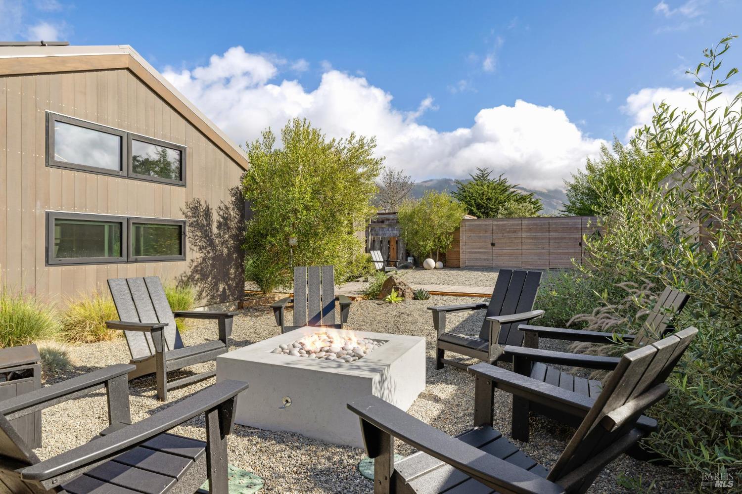 297 Seadrift Road Stinson Beach, CA 94970 - Photo 58 of 68 a view of a patio with table and chairs and potted plants