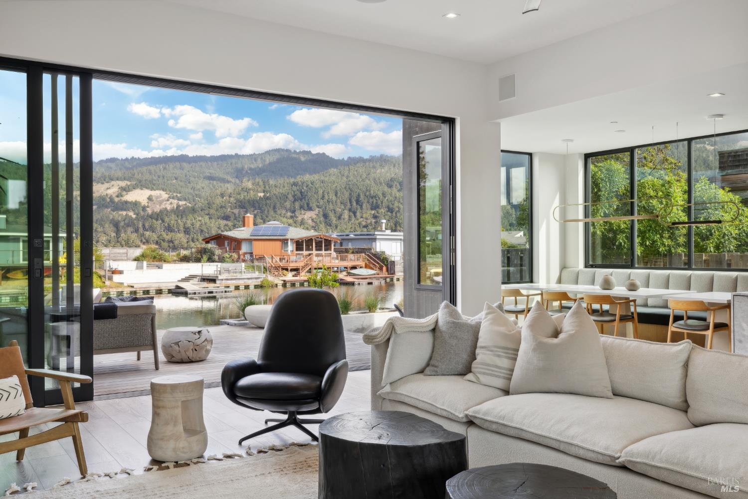 297 Seadrift Road Stinson Beach, CA 94970 - Photo 6 of 30 a living room with furniture and a large window
