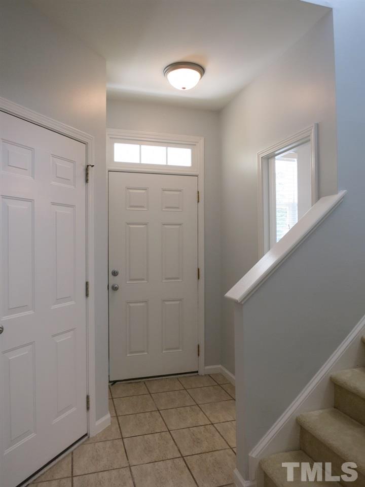 8516 Barryknoll Court Raleigh, NC 27613 - Photo 3 of 25 View of the Entry w/deep coat closet & neutral tile floor. This home features NEW neutral carpet & fresh paint throughout, and 9’ smooth ceilings on the main level.