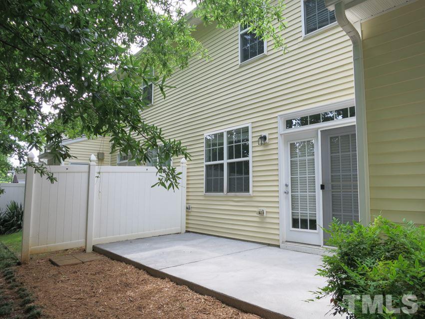 8516 Barryknoll Court Raleigh, NC 27613 - Photo 20 of 25 The nice Patio w/privacy fences on each side is off the Living area, great for grilling and entertaining. There is also a Storage Rm out here.