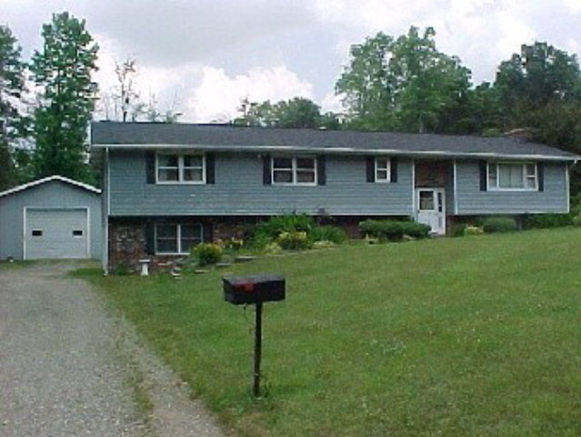 Rd#2 Enterprise-tidioute Road Titusville, PA 16354 - Photo 1 of 1 a front view of a house with garden