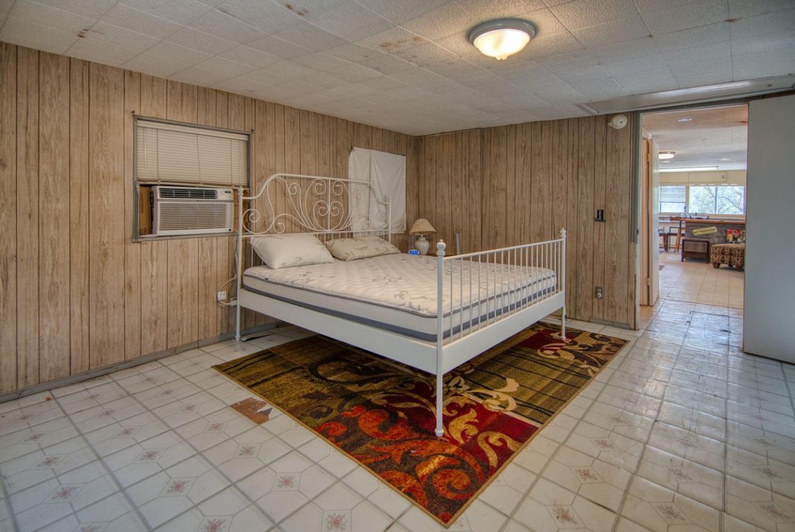 567 County Road 241 Rochelle, TX 76872 - Photo 20 of 22 a bed room with a bed and a television