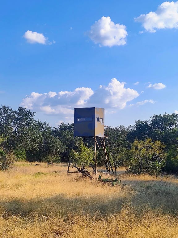 567 County Road 241 Rochelle, TX 76872 - Photo 3 of 22 a view of a lake with a mountain in the background