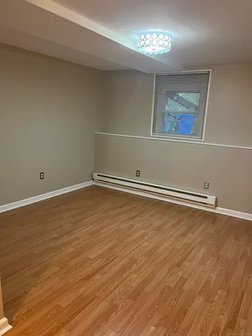 a view of room with wooden floor