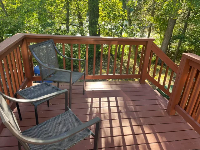 a view of a balcony with wooden floor