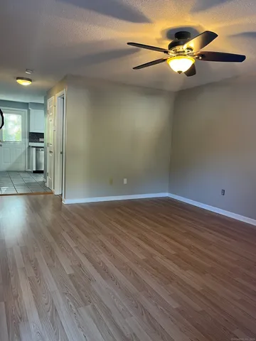 a view of a livingroom with wooden floor