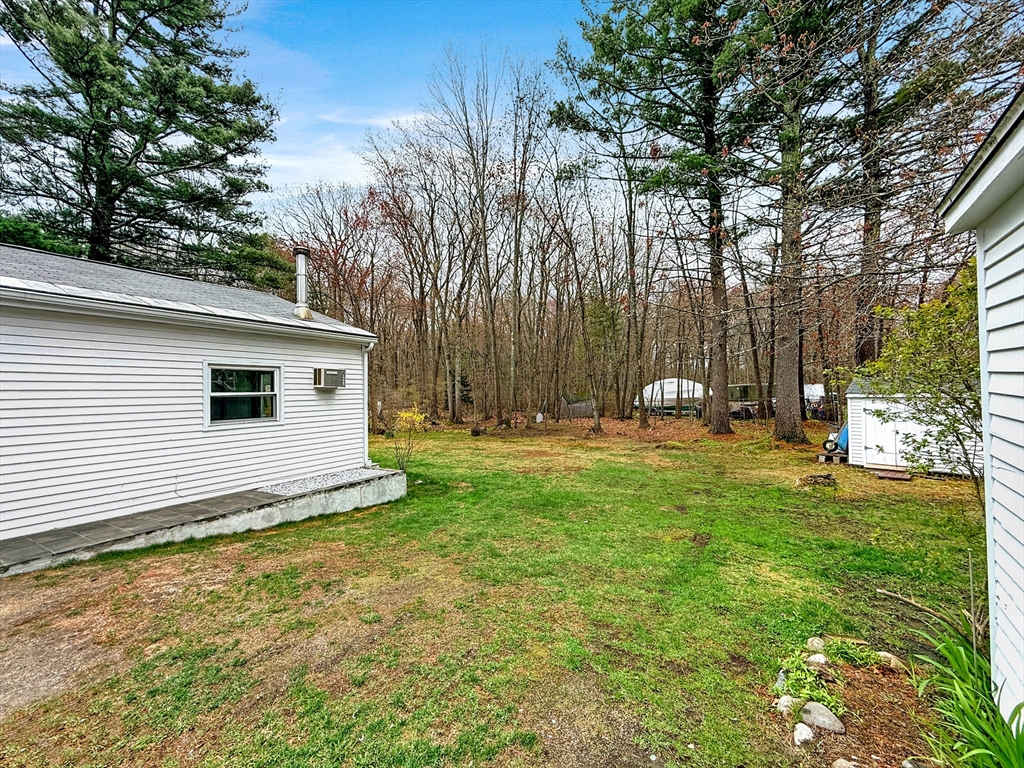 126 Beach Road Salisbury, MA 01952 - Photo 9 of 30 a backyard of a house with lots of green space