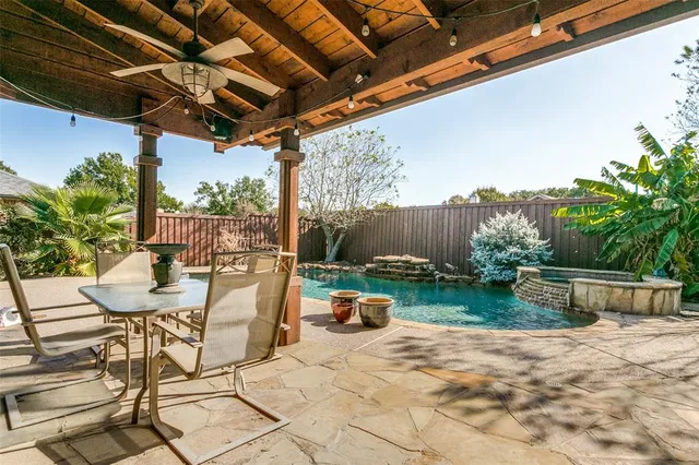 a backyard of a house with seating space