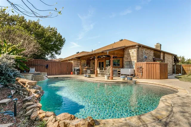 a front view of house with yard patio and green space
