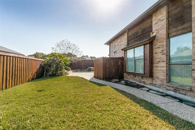 a view of backyard with seating space