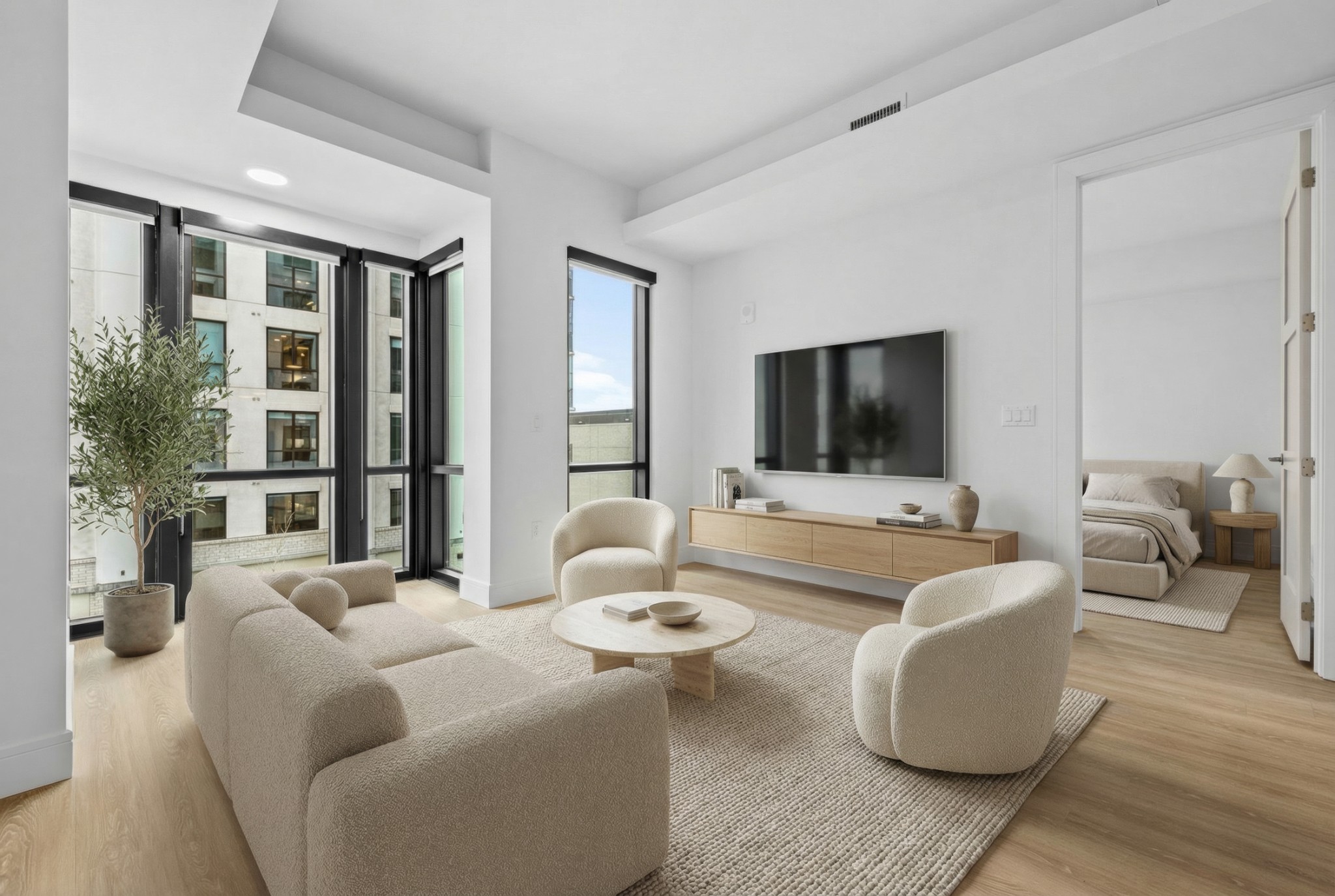 930 Commerce Street, Unit 508 Nashville, TN 37203 - Photo 1 of 65 a living room with furniture and a flat screen tv