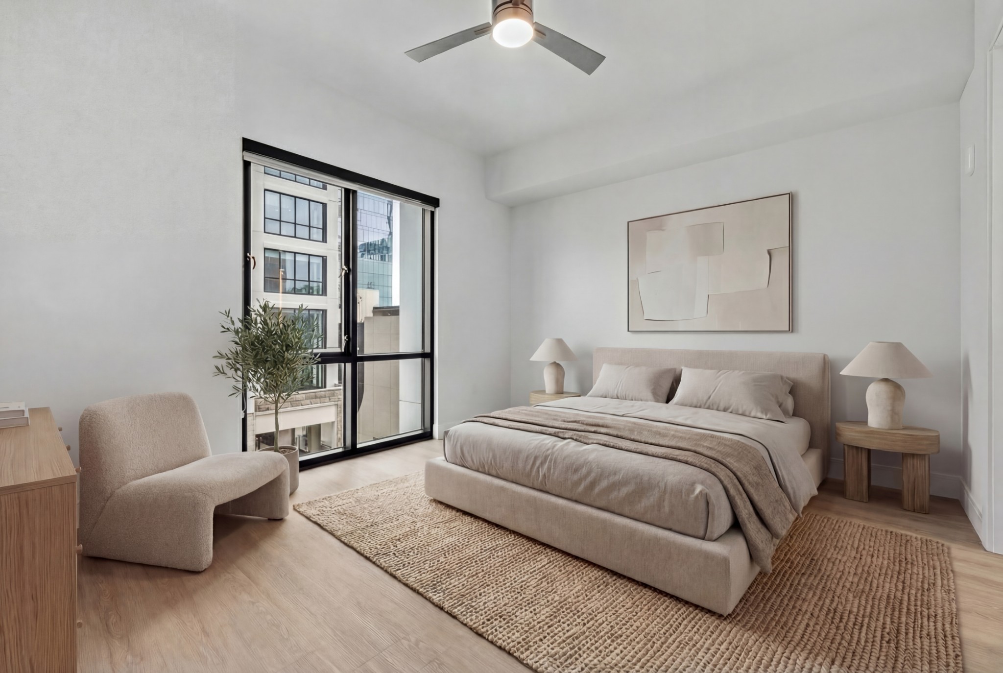 930 Commerce Street, Unit 508 Nashville, TN 37203 - Photo 14 of 65 a spacious bedroom with a bed and a couch