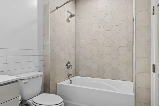a view of a bathroom with a washer and dryer