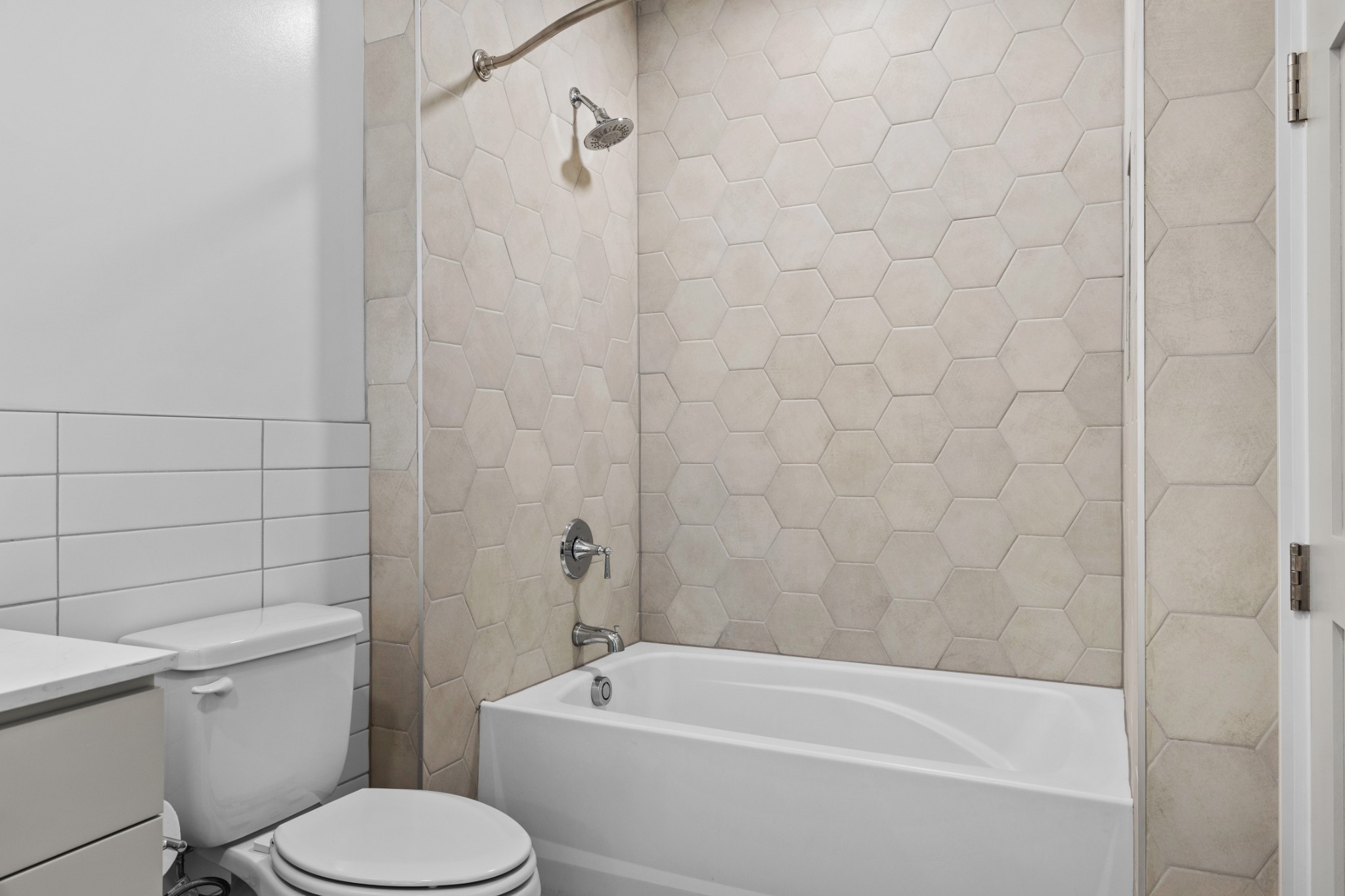 930 Commerce Street, Unit 508 Nashville, TN 37203 - Photo 23 of 65 a white bath tub sitting next to a white toilet and sink