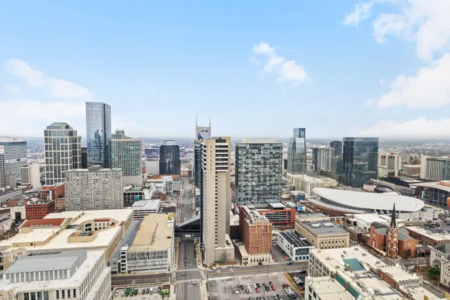 a living room with furniture wooden floor and a flat screen tv