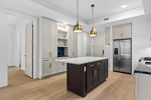 a kitchen with cabinets and white appliances
