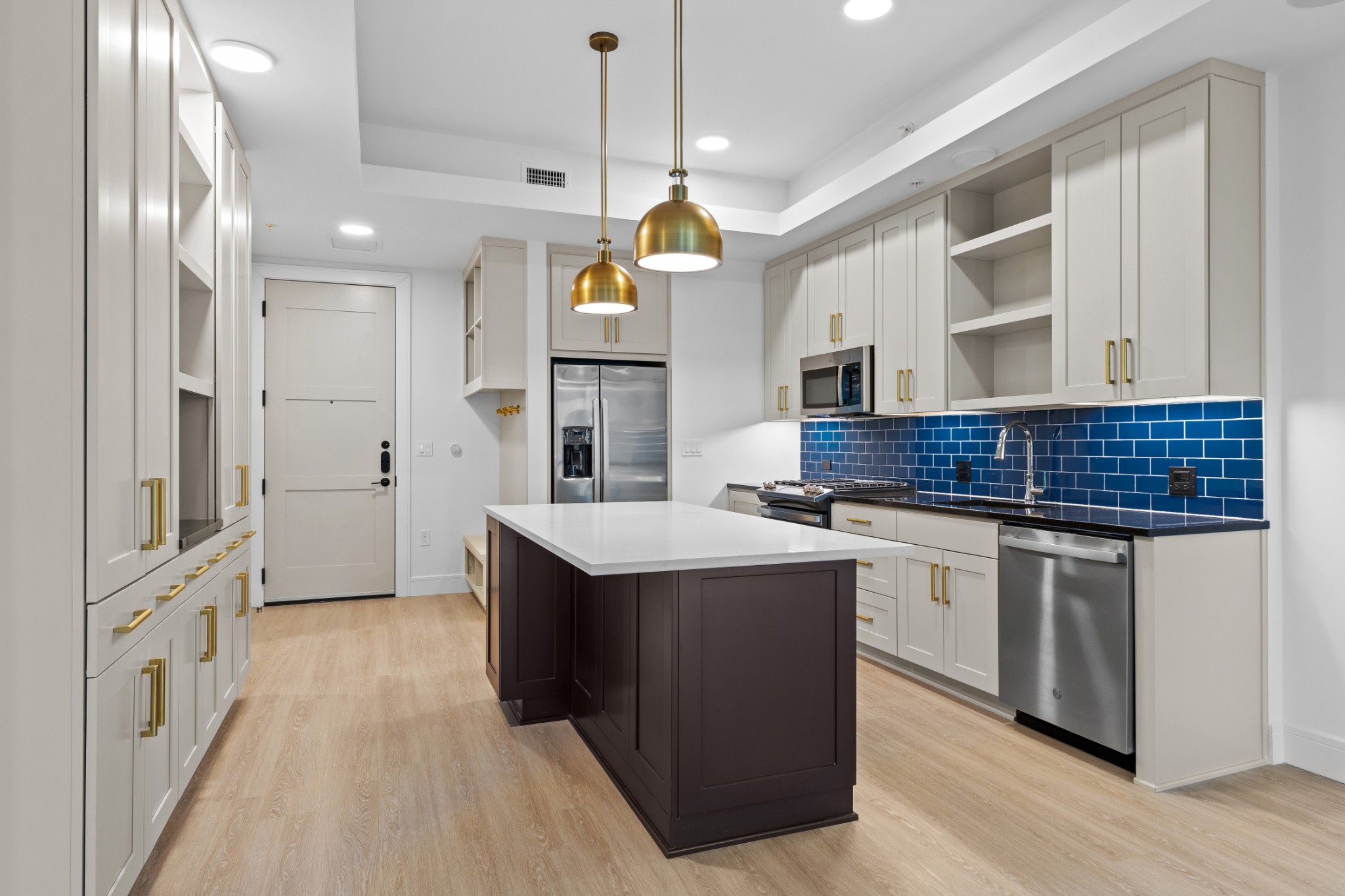 930 Commerce Street, Unit 508 Nashville, TN 37203 - Photo 8 of 65 a kitchen with stainless steel appliances granite countertop a sink stove and refrigerator