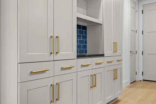 a kitchen with stainless steel appliances granite countertop a stove and a sink