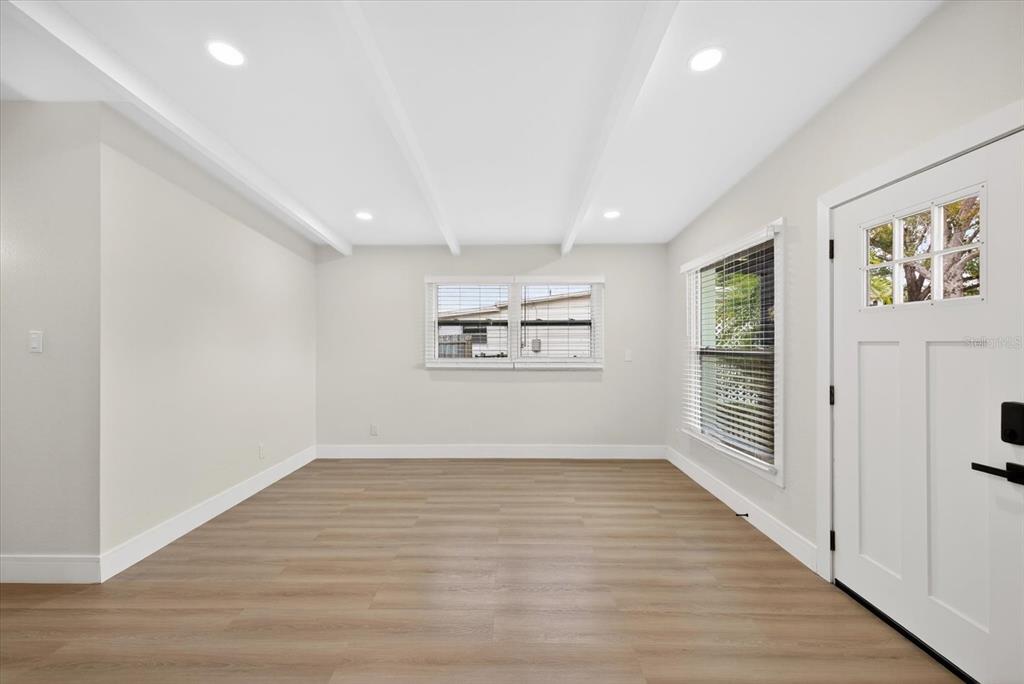 5901 South Coolidge Avenue Tampa, FL 33616 - Photo 11 of 47 wooden floor in an empty room with a window