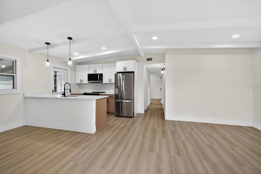 5901 South Coolidge Avenue Tampa, FL 33616 - Photo 12 of 47 a kitchen with stainless steel appliances a refrigerator and a stove top oven