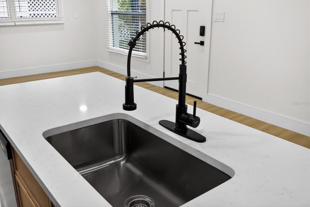 5901 South Coolidge Avenue Tampa, FL 33616 - Photo 16 of 47 a view of a hall with a floor to ceiling window