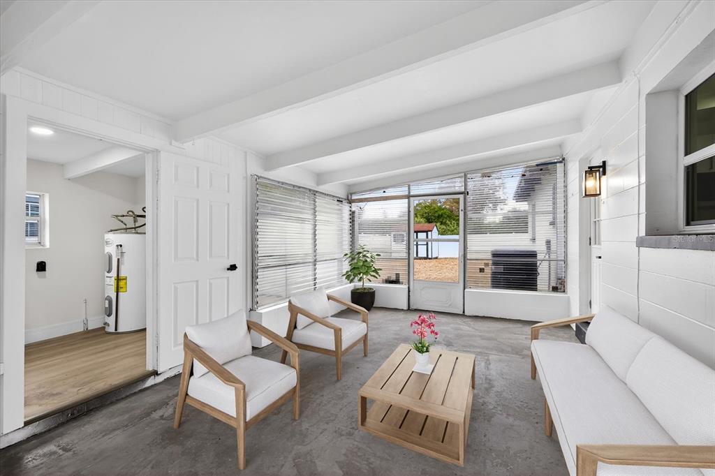 5901 South Coolidge Avenue Tampa, FL 33616 - Photo 19 of 47 a living room with furniture and a large window