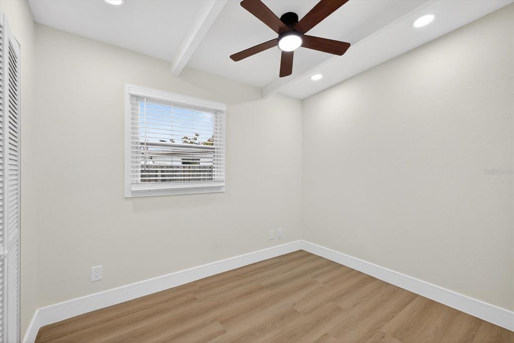 5901 South Coolidge Avenue Tampa, FL 33616 - Photo 25 of 47 an empty room with wooden floor and windows