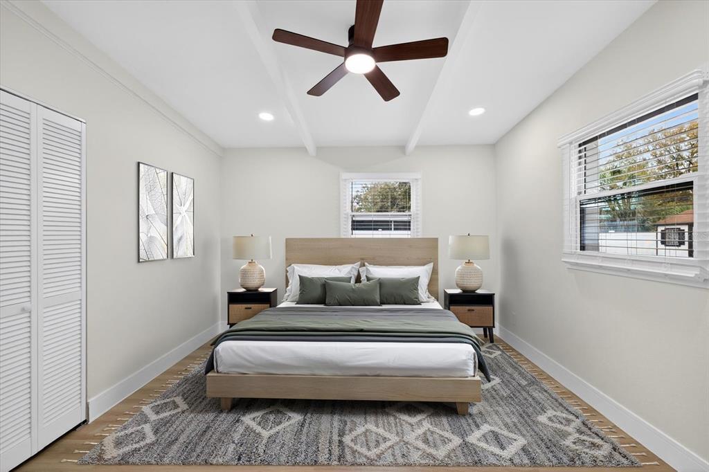 5901 South Coolidge Avenue Tampa, FL 33616 - Photo 29 of 47 a bedroom with a large bed chandelier and a window