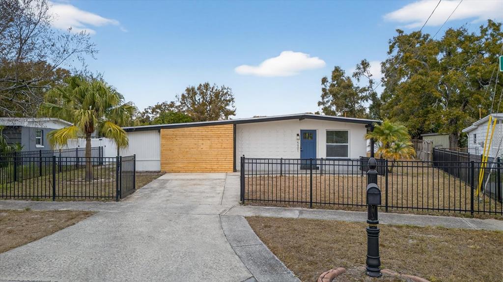 5901 South Coolidge Avenue Tampa, FL 33616 - Photo 3 of 47 a view of a house with a backyard and garage