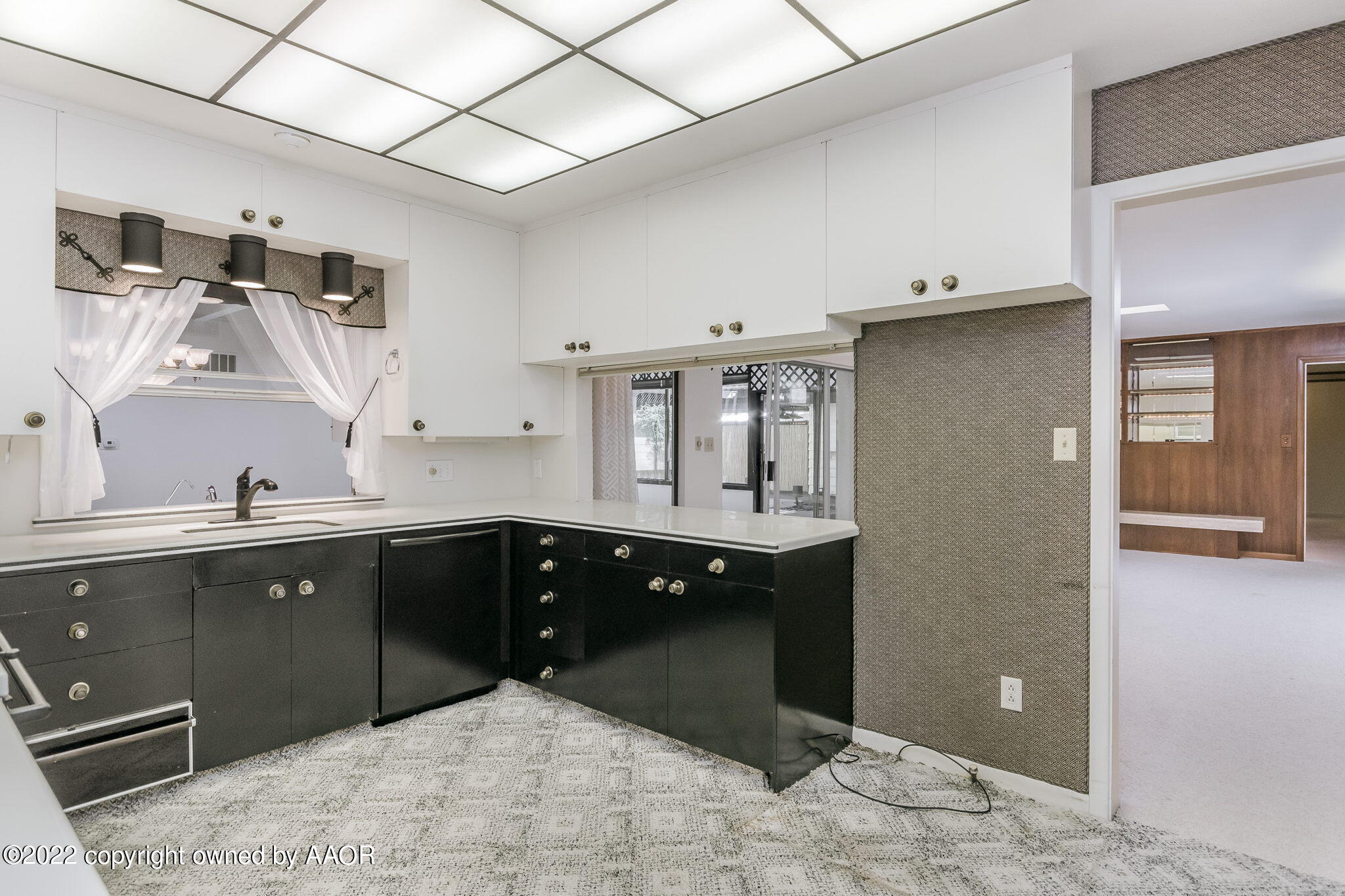 6016 Dreyfuss Road Amarillo, TX 79106 - Photo 27 of 91 a kitchen with a sink and cabinets