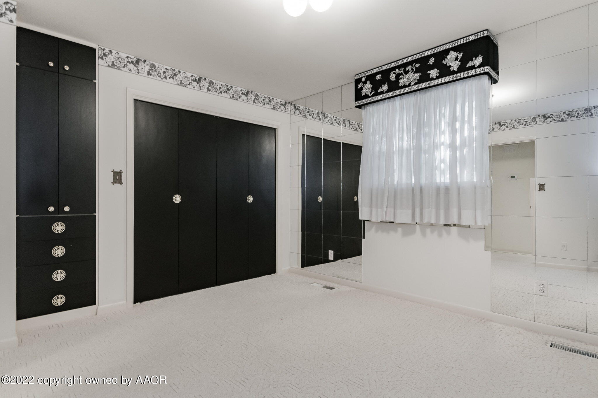 6016 Dreyfuss Road Amarillo, TX 79106 - Photo 39 of 91 a view of a hallway with wooden shelves