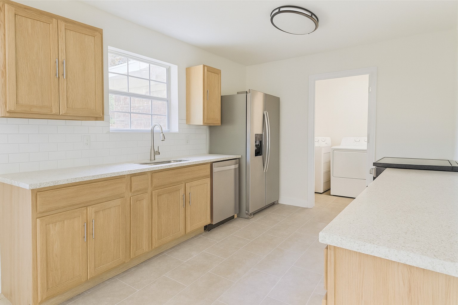 422 FM 360 Road Beasley, TX 77417 - Photo 14 of 25 a kitchen with a refrigerator sink and cabinets