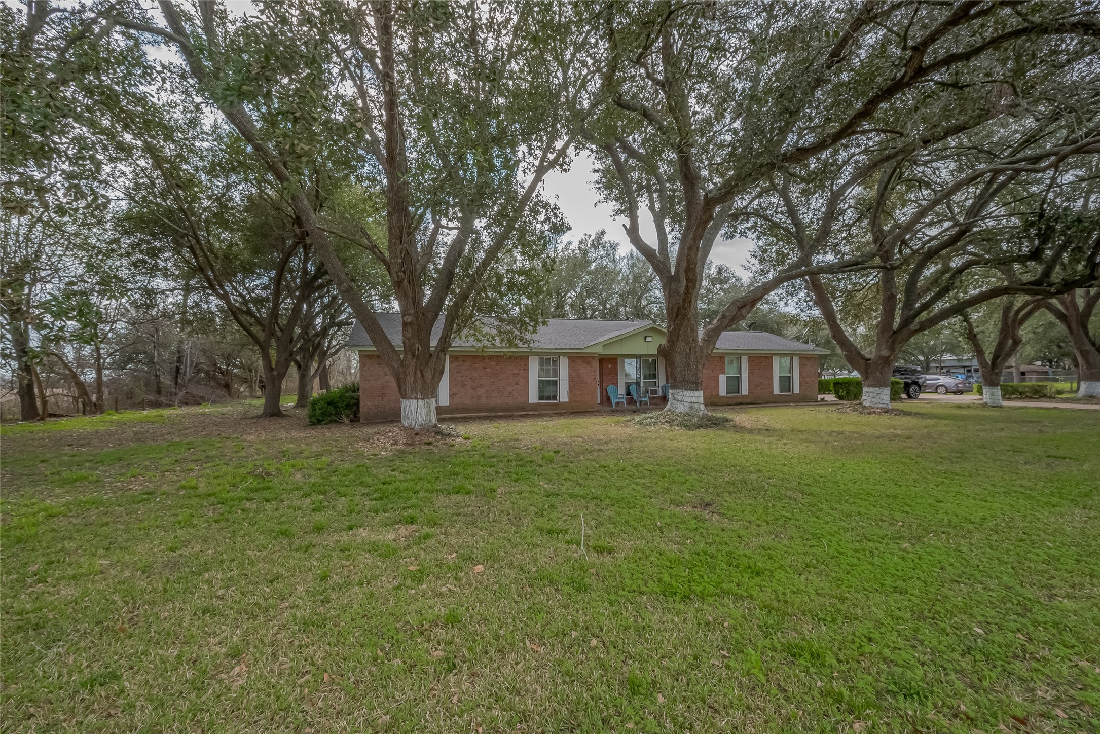 422 FM 360 Road Beasley, TX 77417 - Photo 23 of 25 a front view of a house with garden
