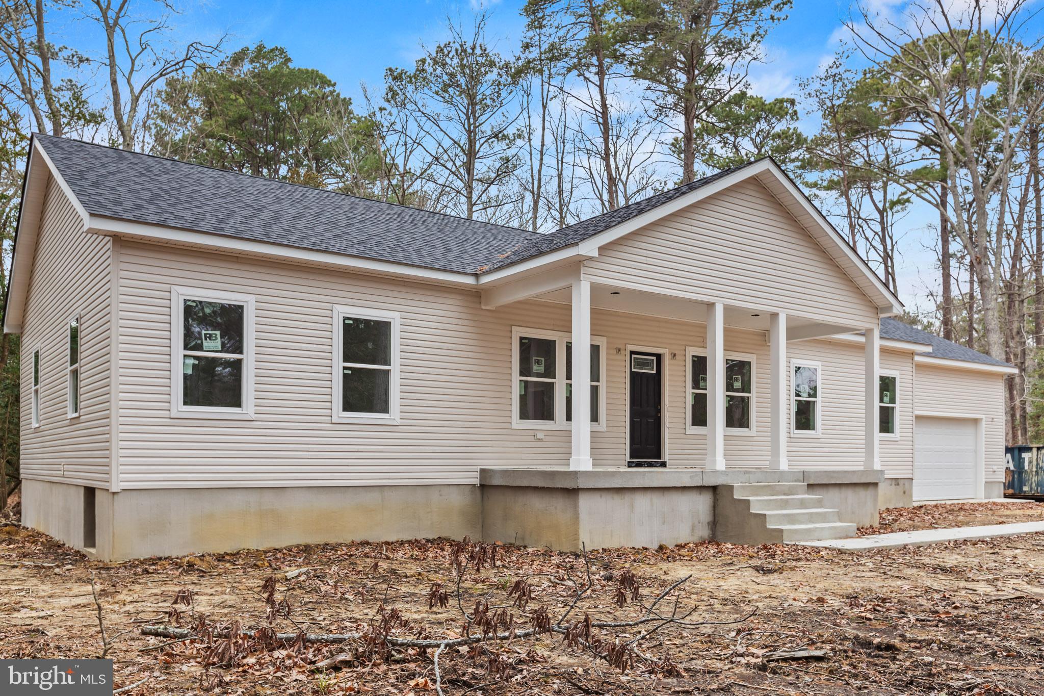 17881 Three Notch Road Lexington Park, MD 20653 - Photo 11 of 17 a front view of a house with a yard