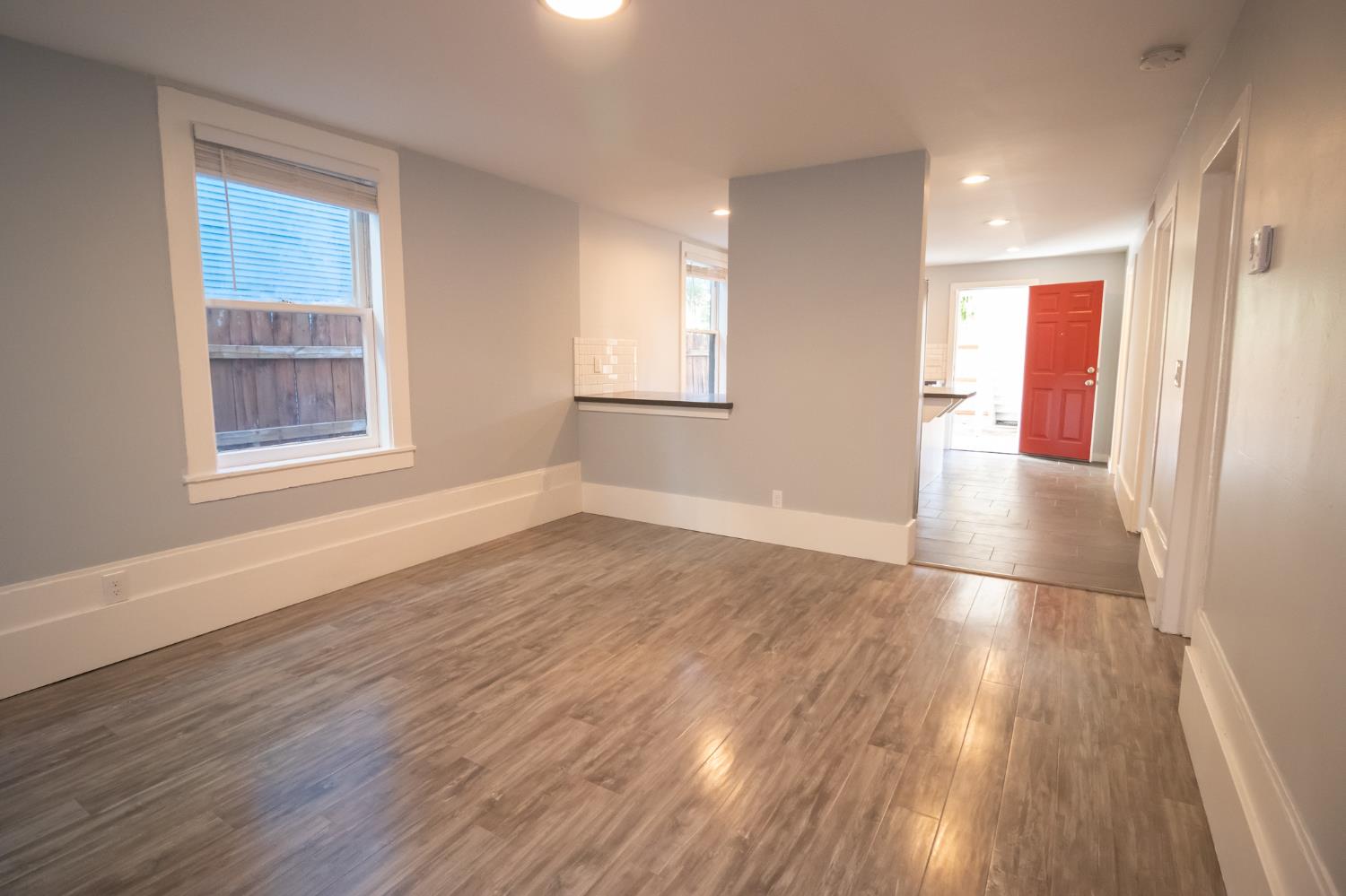 1317 D Street Sacramento, CA 95814 - Photo 3 of 16 an empty room with wooden floor and windows