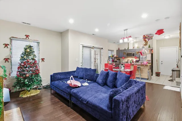 a living room with furniture and flowers