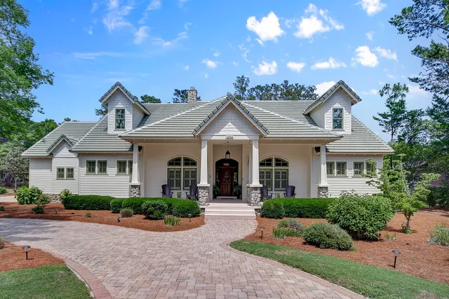 a front view of a house with yard