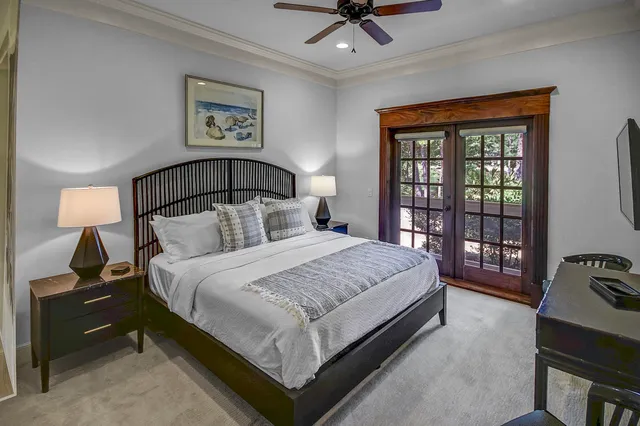 a bedroom with a large bed and a tv