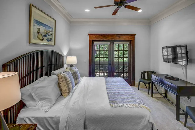 a bed sitting in a bedroom next to a window