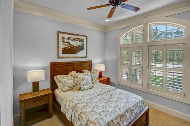 a bedroom with bed and a window