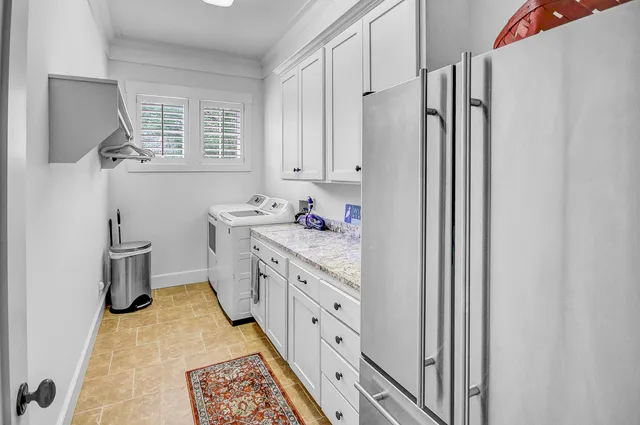 a kitchen with stainless steel appliances a sink and a refrigerator